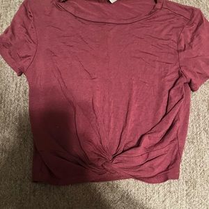 This is a maroon crop top that has never been worn
